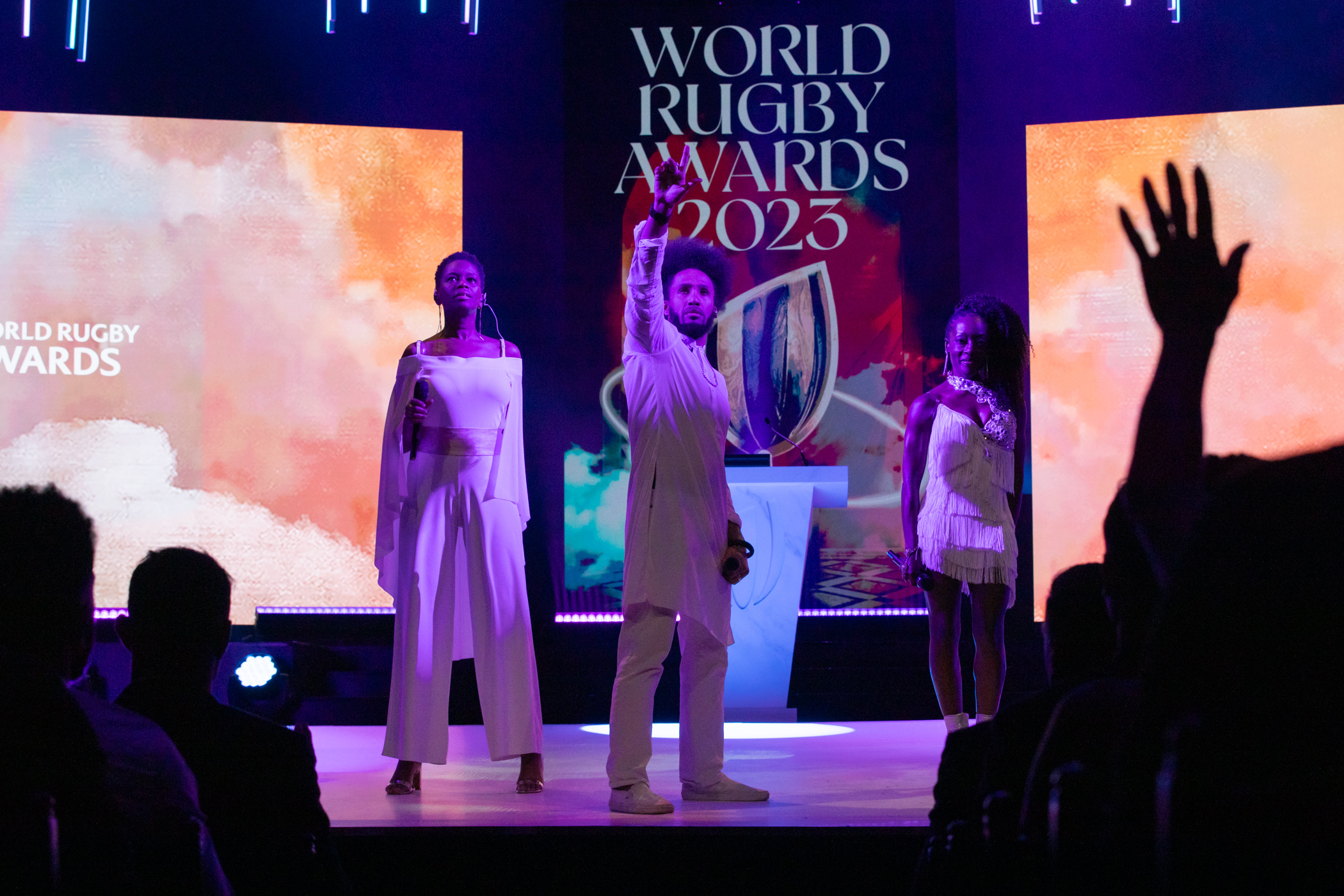 Live Showband Performance World Rugby Awards 2023 Three live vocalists in white performing on stage at the World Rugby Awards 2023.