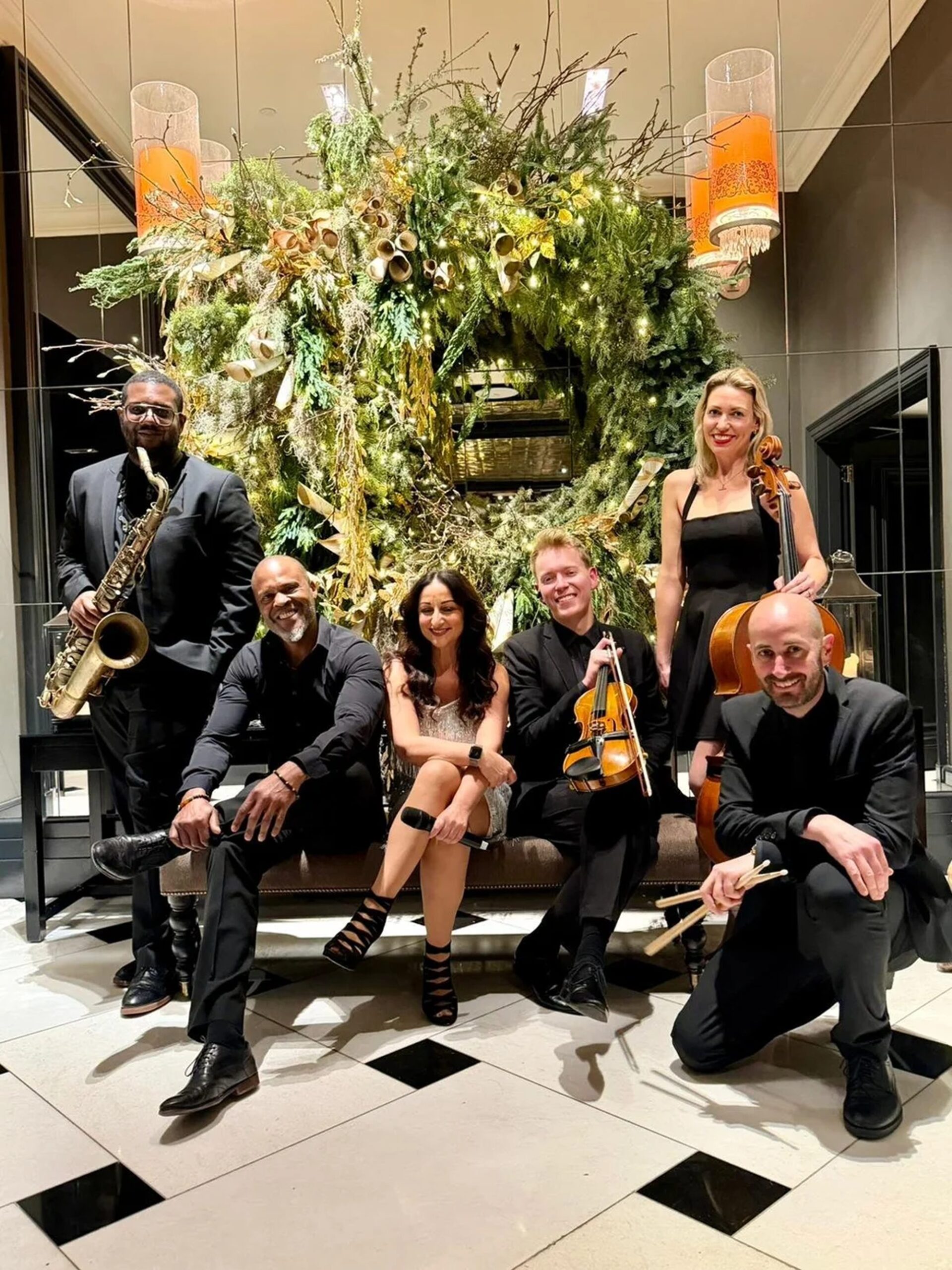 Jazz Band — Full Ensemble Six-piece Jazz Band ensemble grouped by a foliage installation